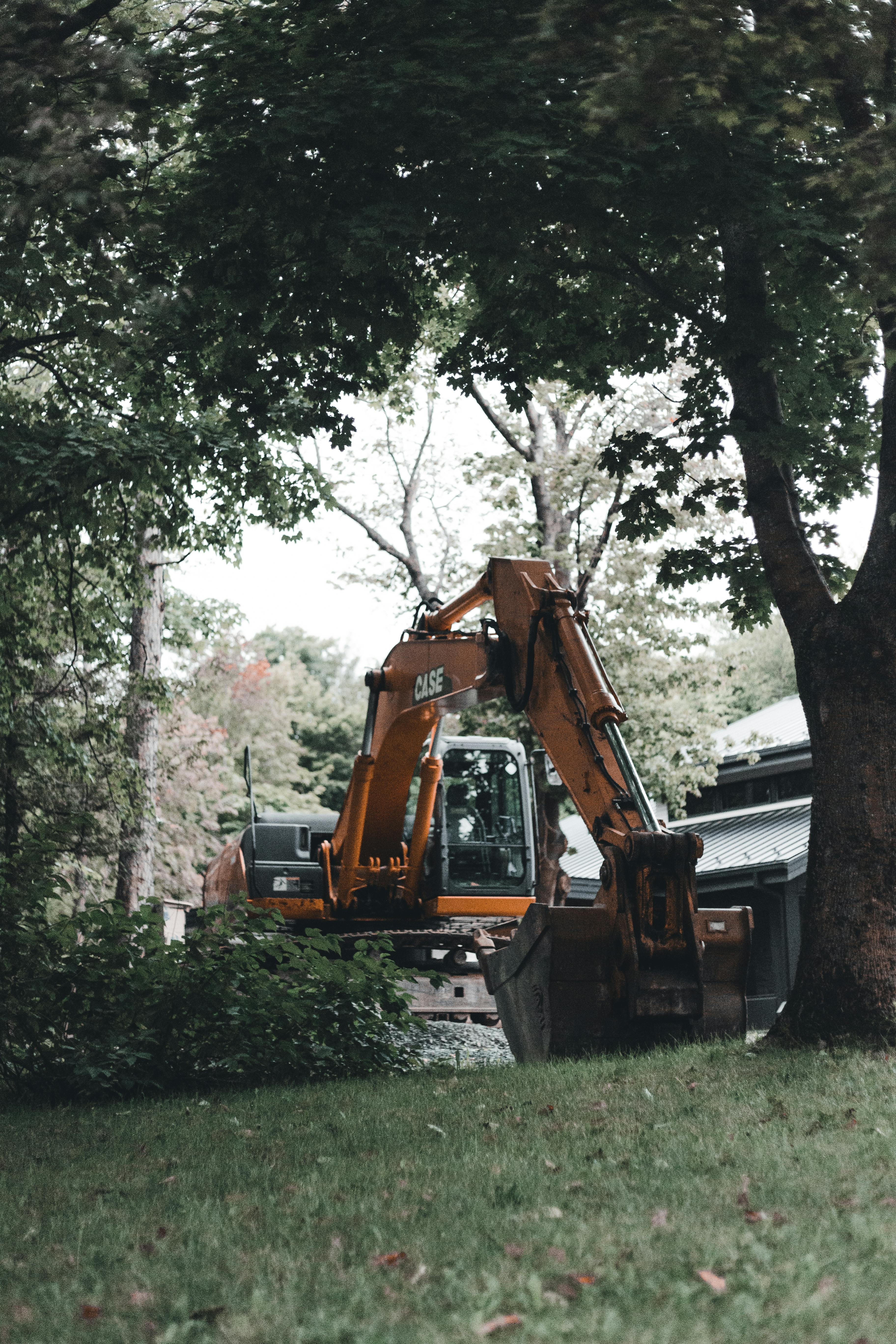 Excavator clearing a lot for new construction